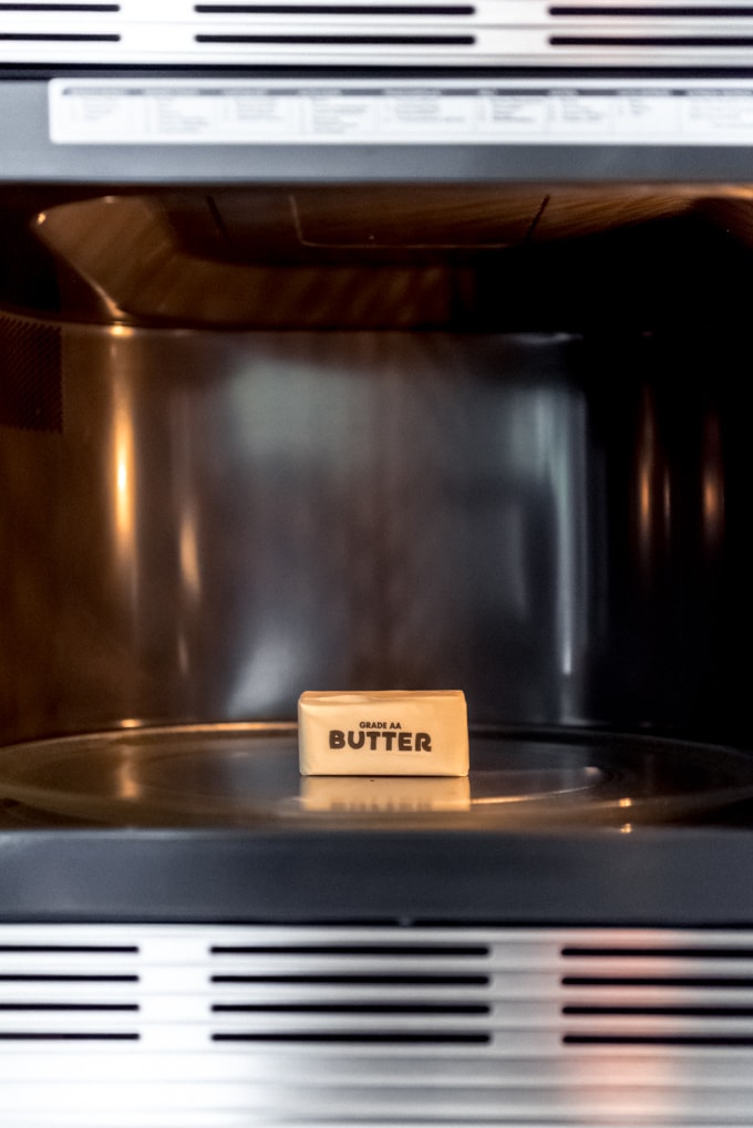 An image of a stick of butter in a microwave.