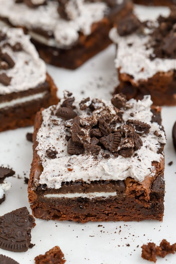 Brownie topped with cookies and cream frosting and crushed Oreos. 