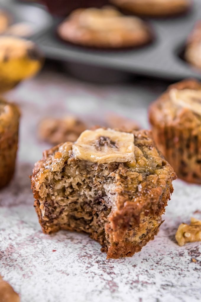 A banana bran muffin with a bite taken out of it.