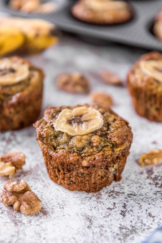 A muffins with a sliced banana on top