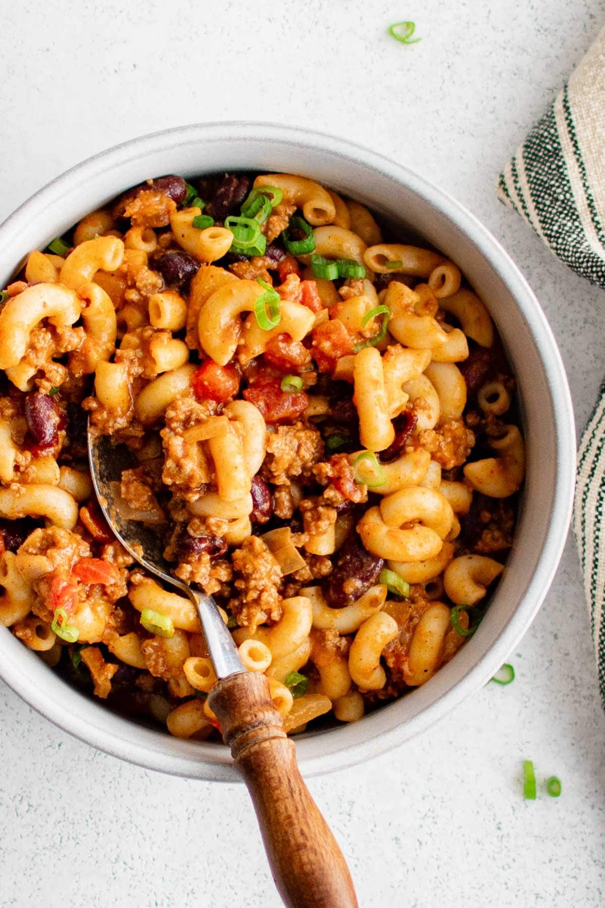 Bowl of chili mac with a spoon.