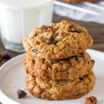 A stack of 3 thick and chewy cowboy cookies.