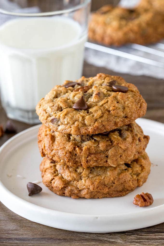 A stack of 3 cookies made with oats, chocolate chips and pecans