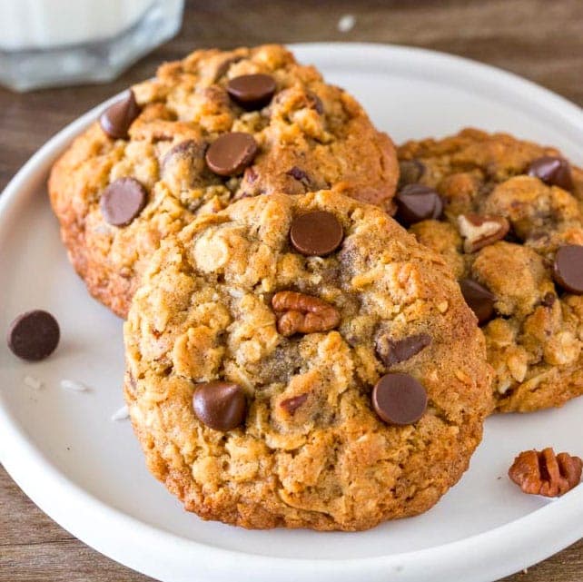 A plate of cookies with chocolate chips and nuts