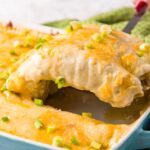 A close up of cheesy Chicken Enchiladas