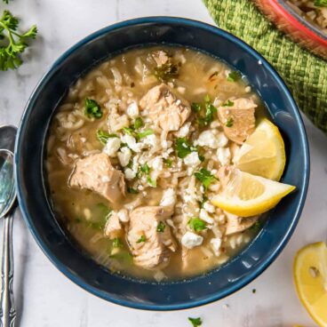 A bowl of chicken soup with lemon