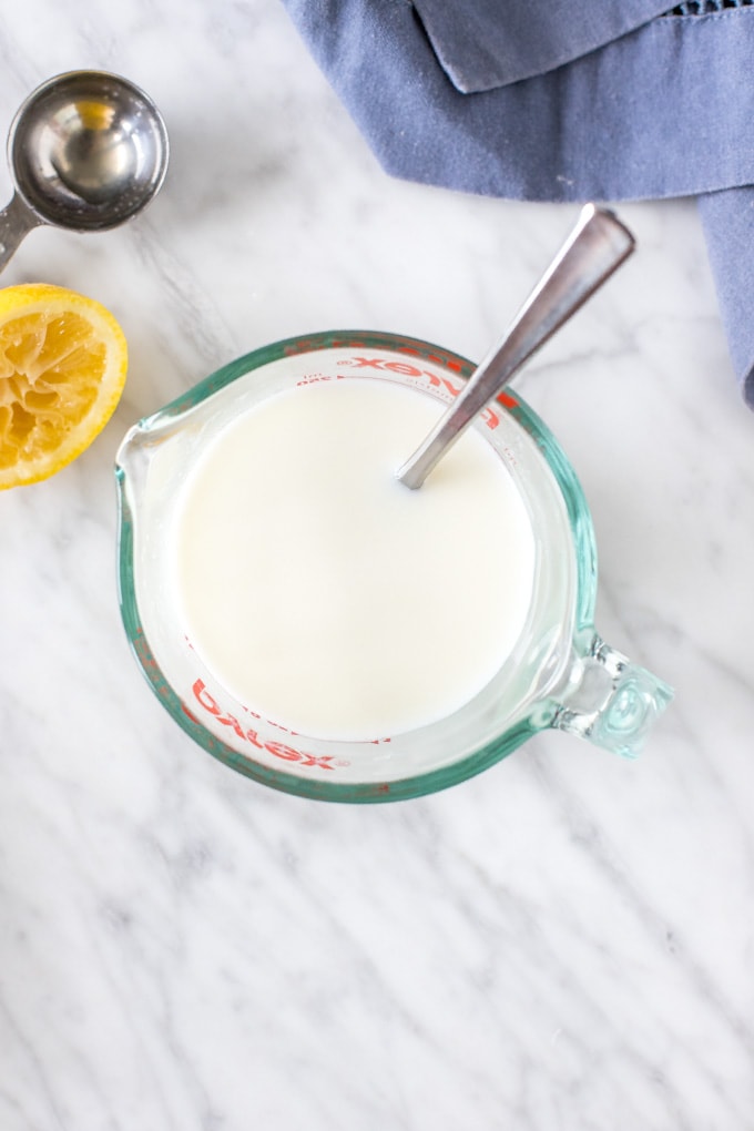 Overhead shot of a measuring cup of buttermilk. 