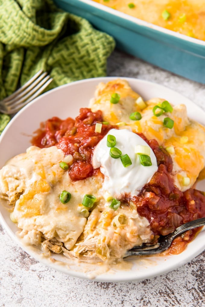 2 enchiladas on a plate showing the filling. 