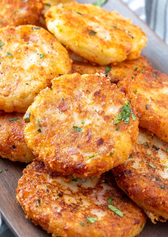 a close up of a stack of potato croquettes