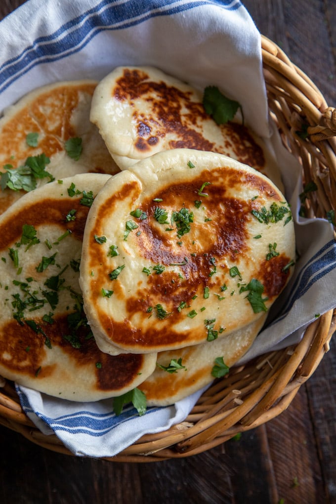 naan bread with cilantro, in a basket