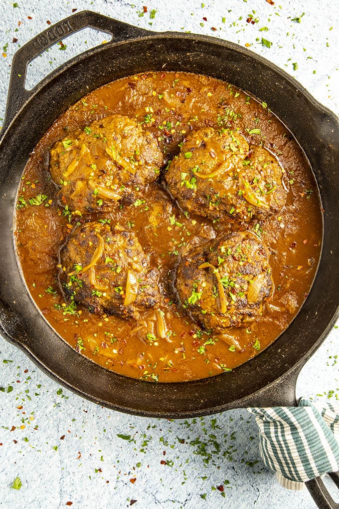 Salisbury Steaks smothered with ancho gravy, ready to serve