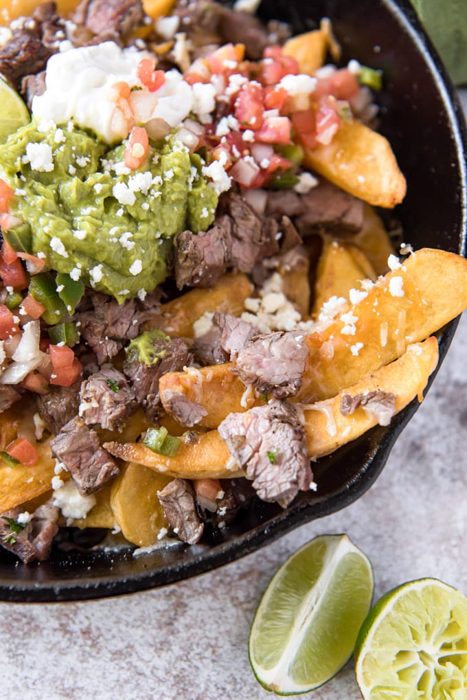 steak fries loaded with carne asada, pico and guacamole and cheese