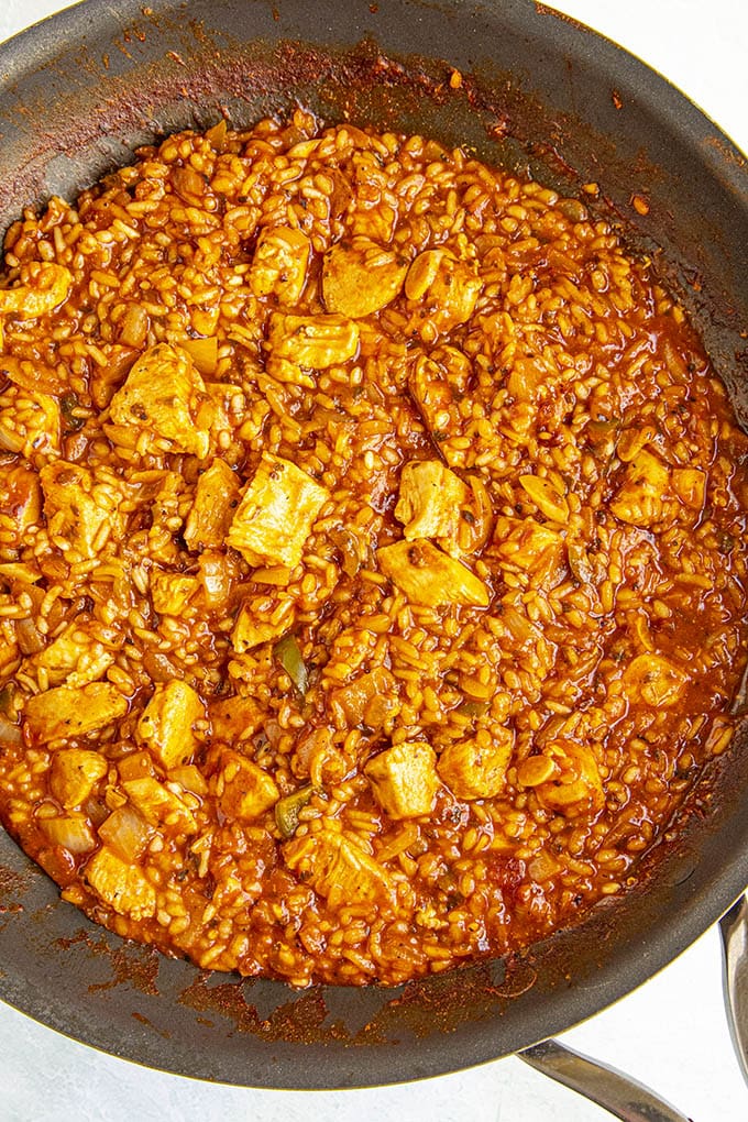 Fluffy seasoned rice and chicken for stuffing our peppers