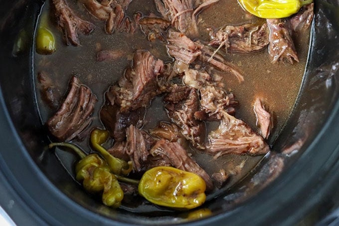 overhead shot of mississippi pot roast in the slow cooker