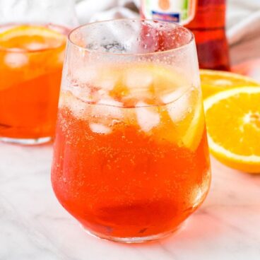 A glass of aperol spritz with ice