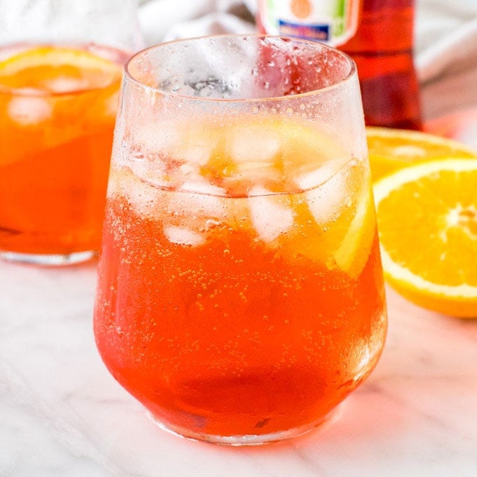 A glass of aperol spritz with ice