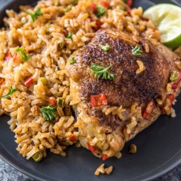 A plate of Spanish rice and chicken.