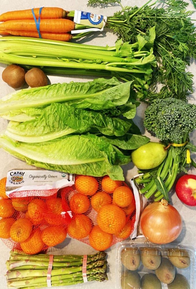 A counter topped with lots of fresh produce