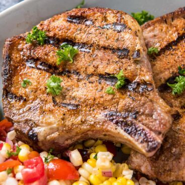 Grilled pork chops with side of corn salad