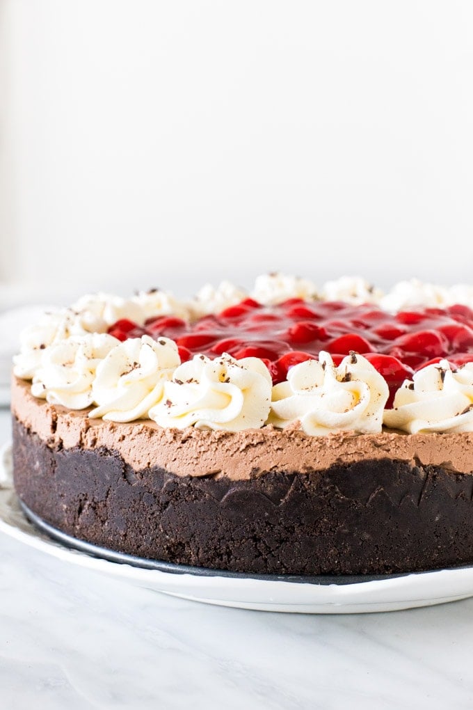 Entire black forest cheesecake topped with cherry pie filling. 