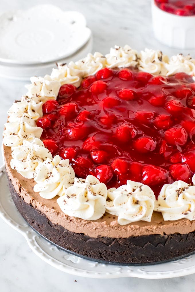 Entire black forest cheesecake topped with cherry pie filling. 