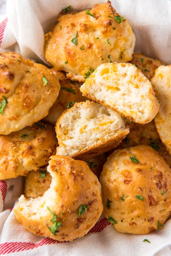 Biscuits with cheese and parsley on top.
