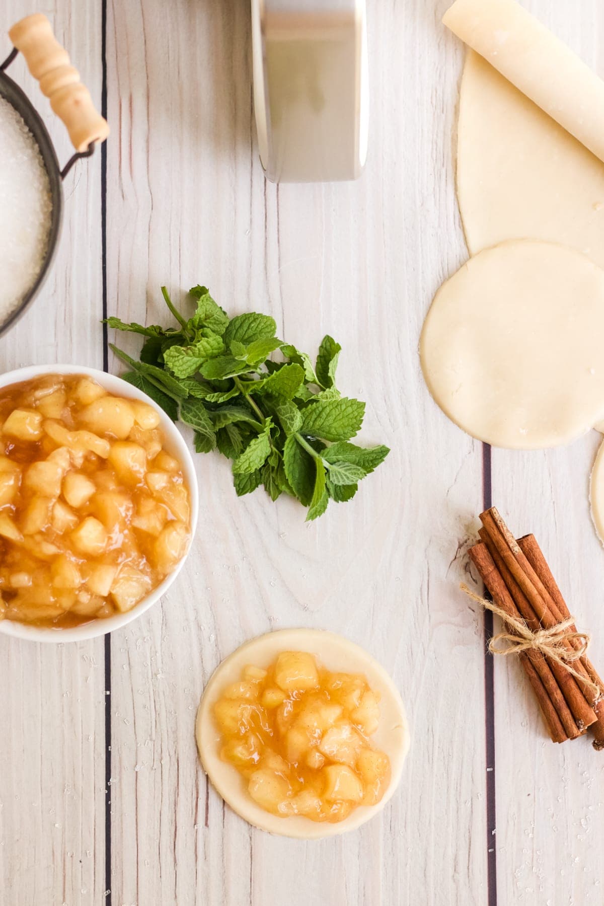 bowl of apple pie filling and pie crusts