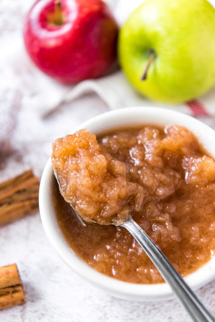 a small dish of homemade applesauce with a spoon