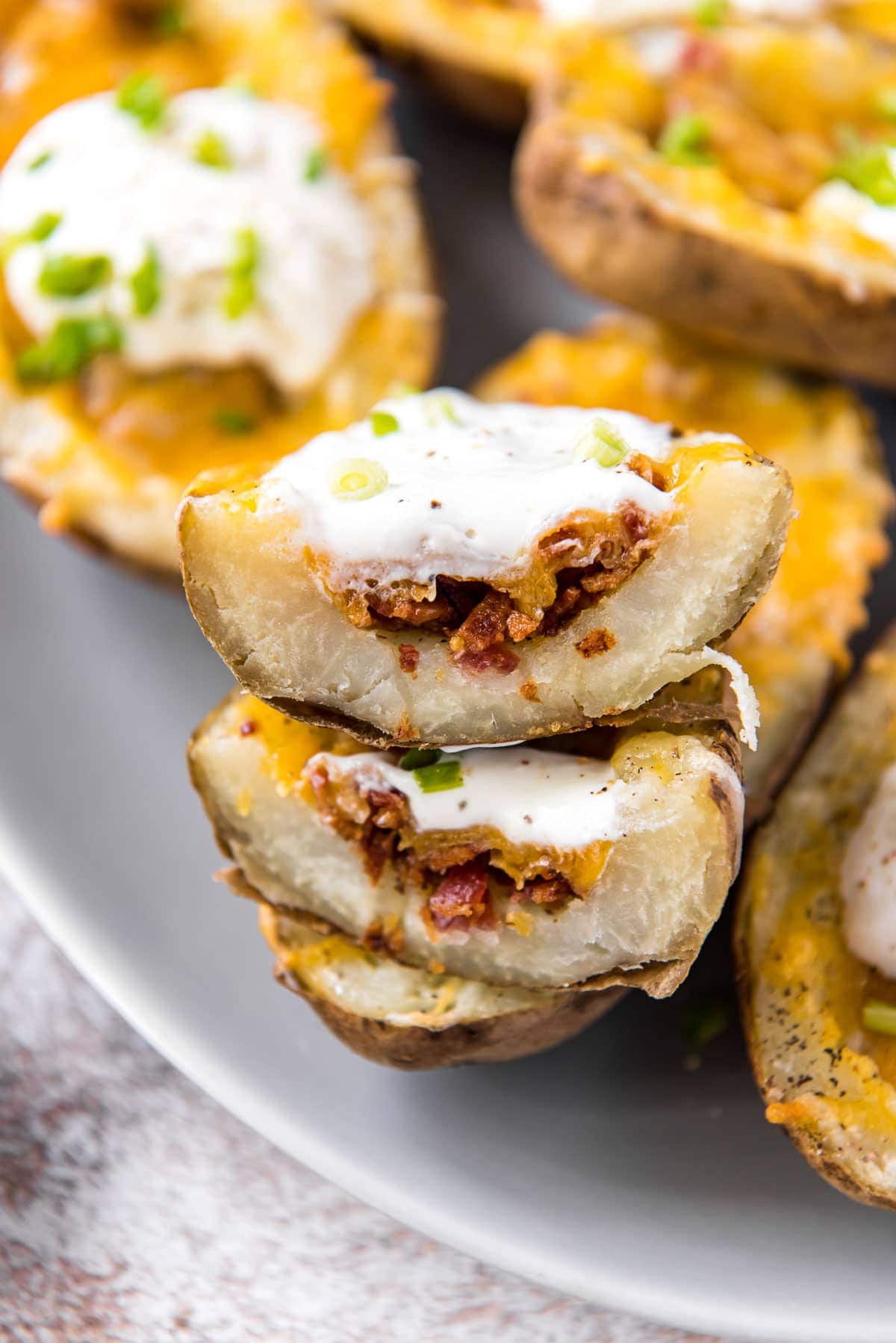 potato skins with bacon, cheese and sour cream cut in half
