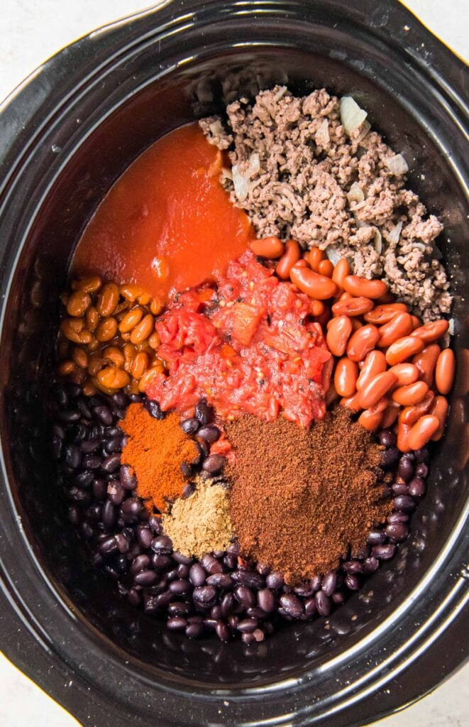 Ingredients for slow cooker chili in a crockpot.