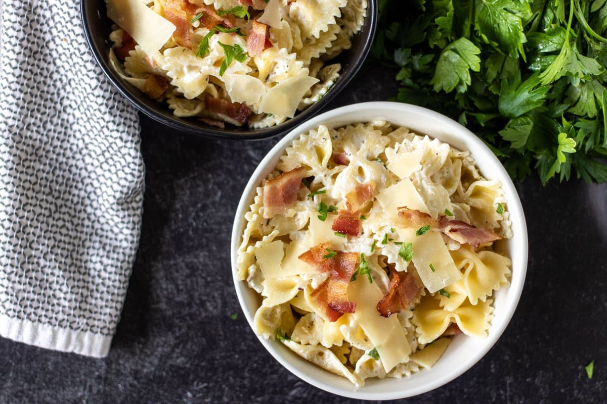 overhead shot of bowls of bowtie pasta