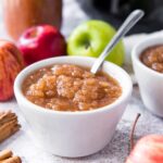 Small white dish full of applesauce.