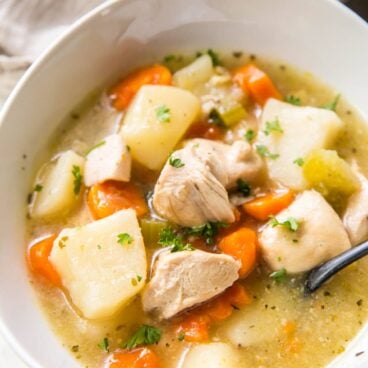 chicken stew in a white bowl on a table