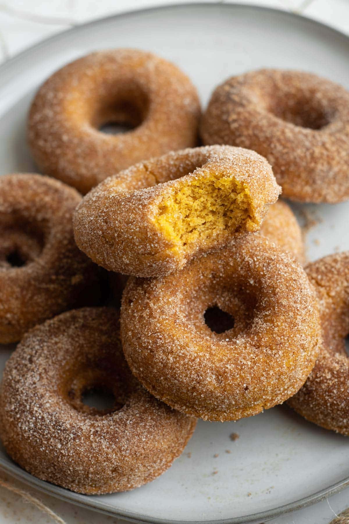 white platter of pumpkin donuts