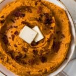 mashed sweet potatoes with bacon and 2 pats of butter