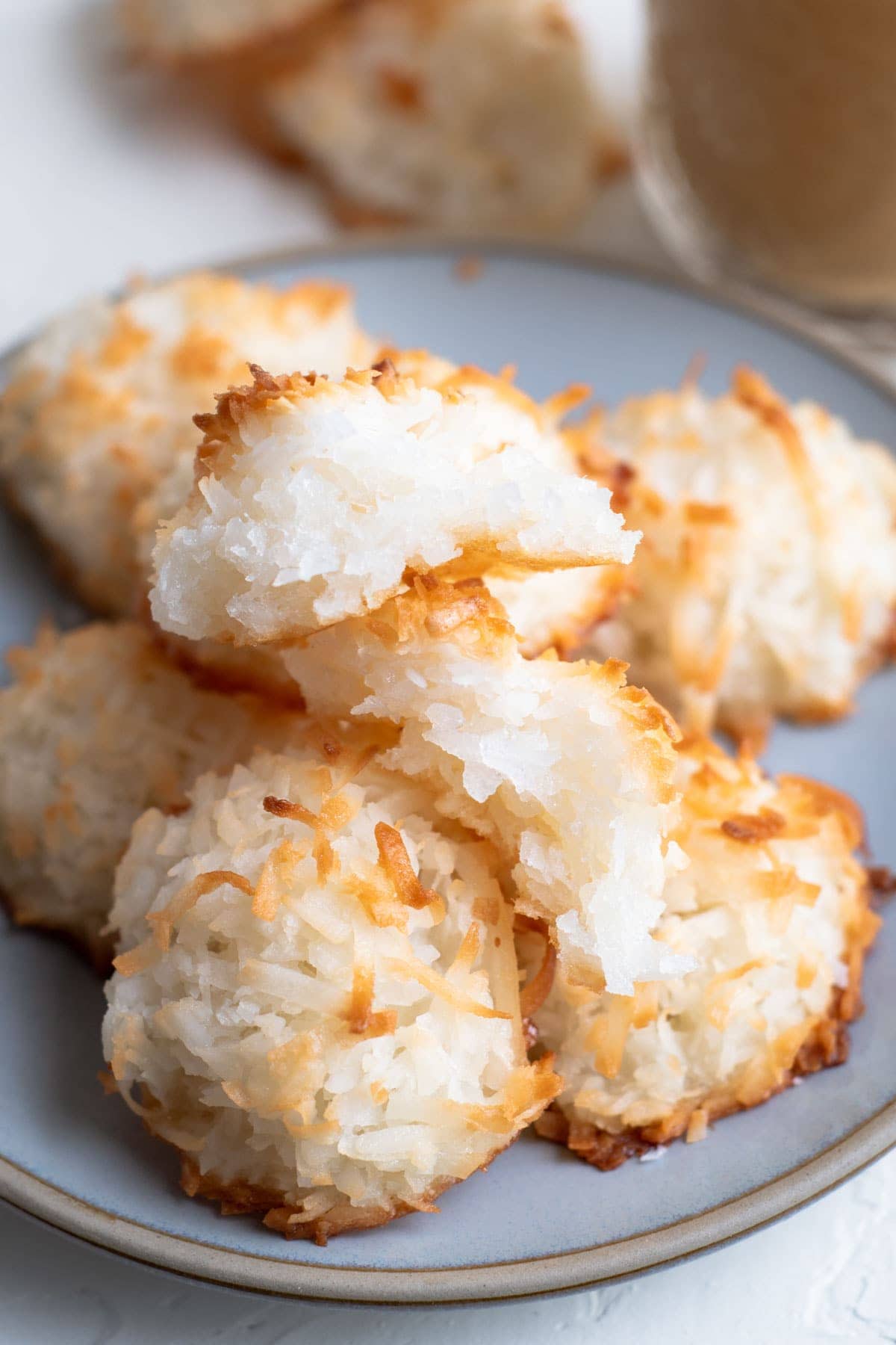 plate of coconut cookies, a split cookie to reveal the moist insides