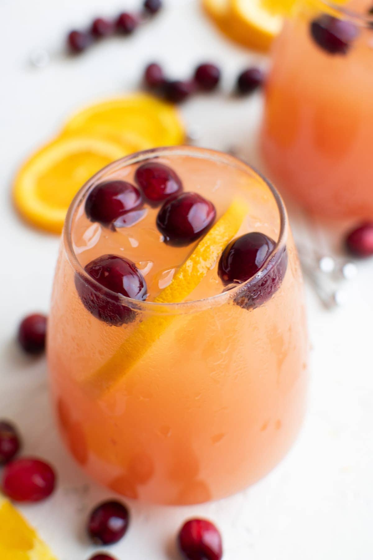glass of holiday punch, cranberries, orange slices