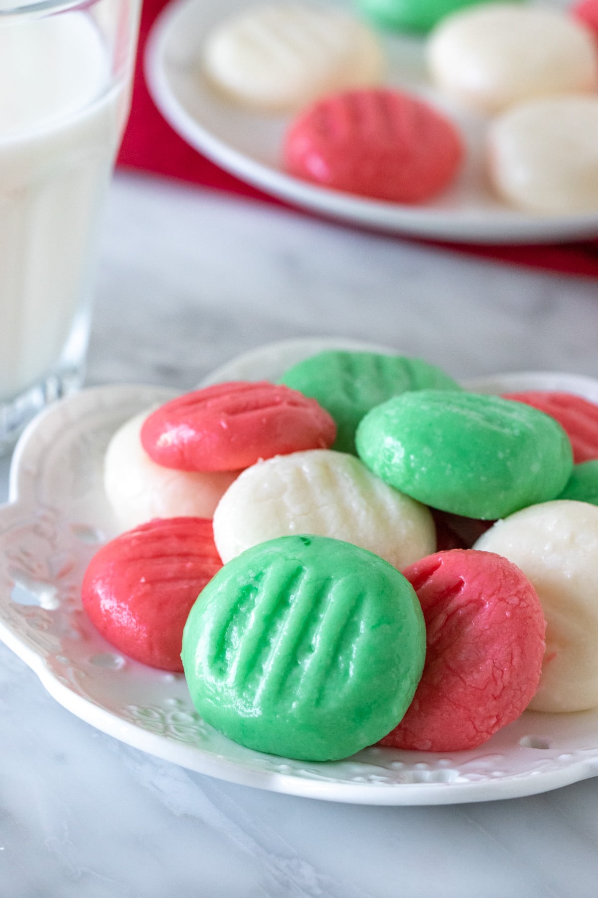 Plate of multi colored cream cheese mints. 