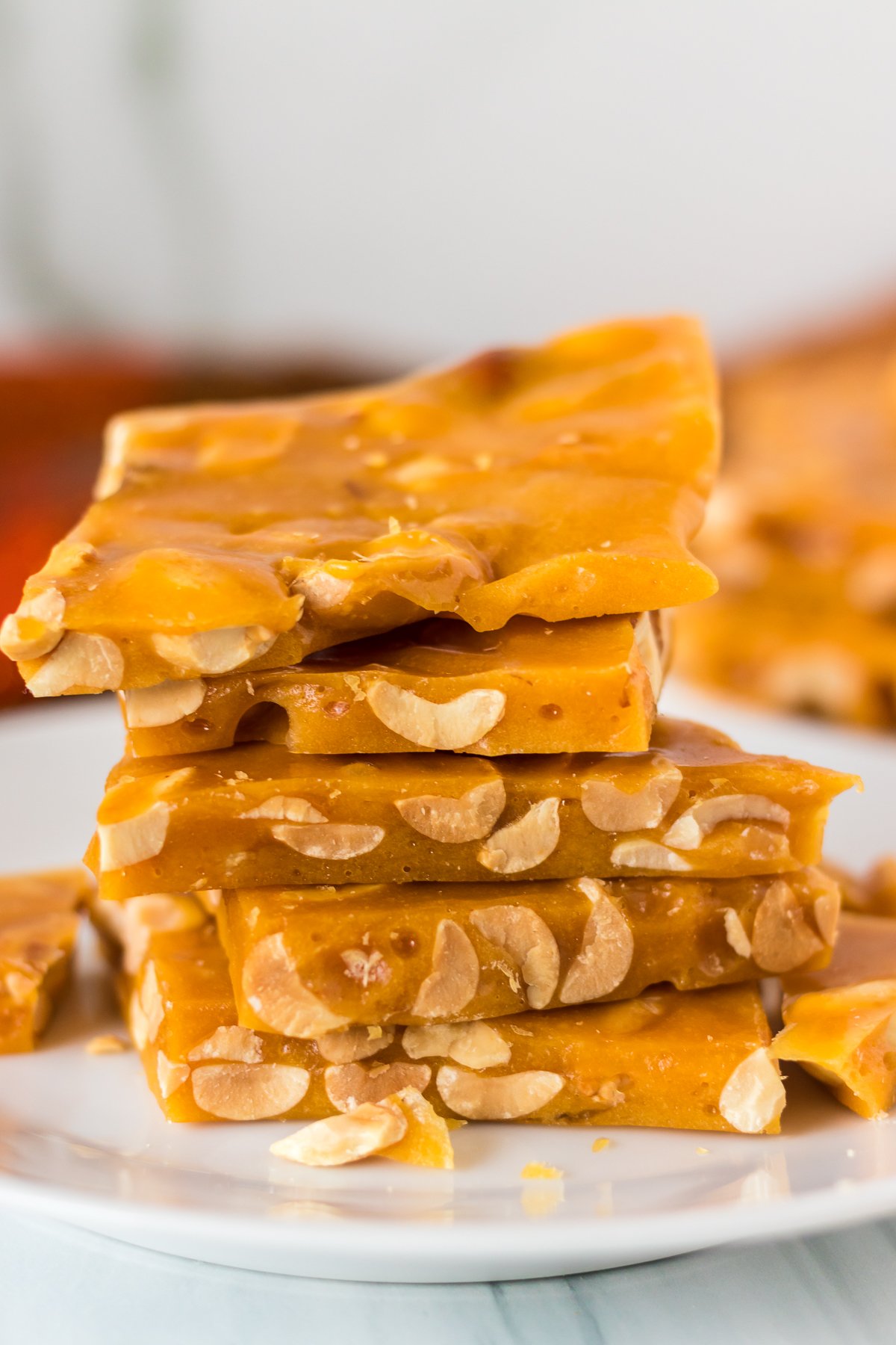 stack of peanut brittle on a white plate