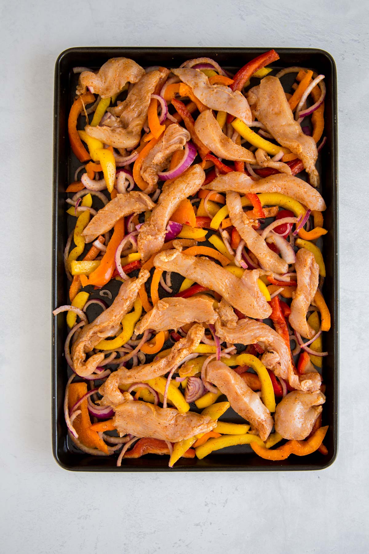 sheet pan chicken fajitas before being cooked