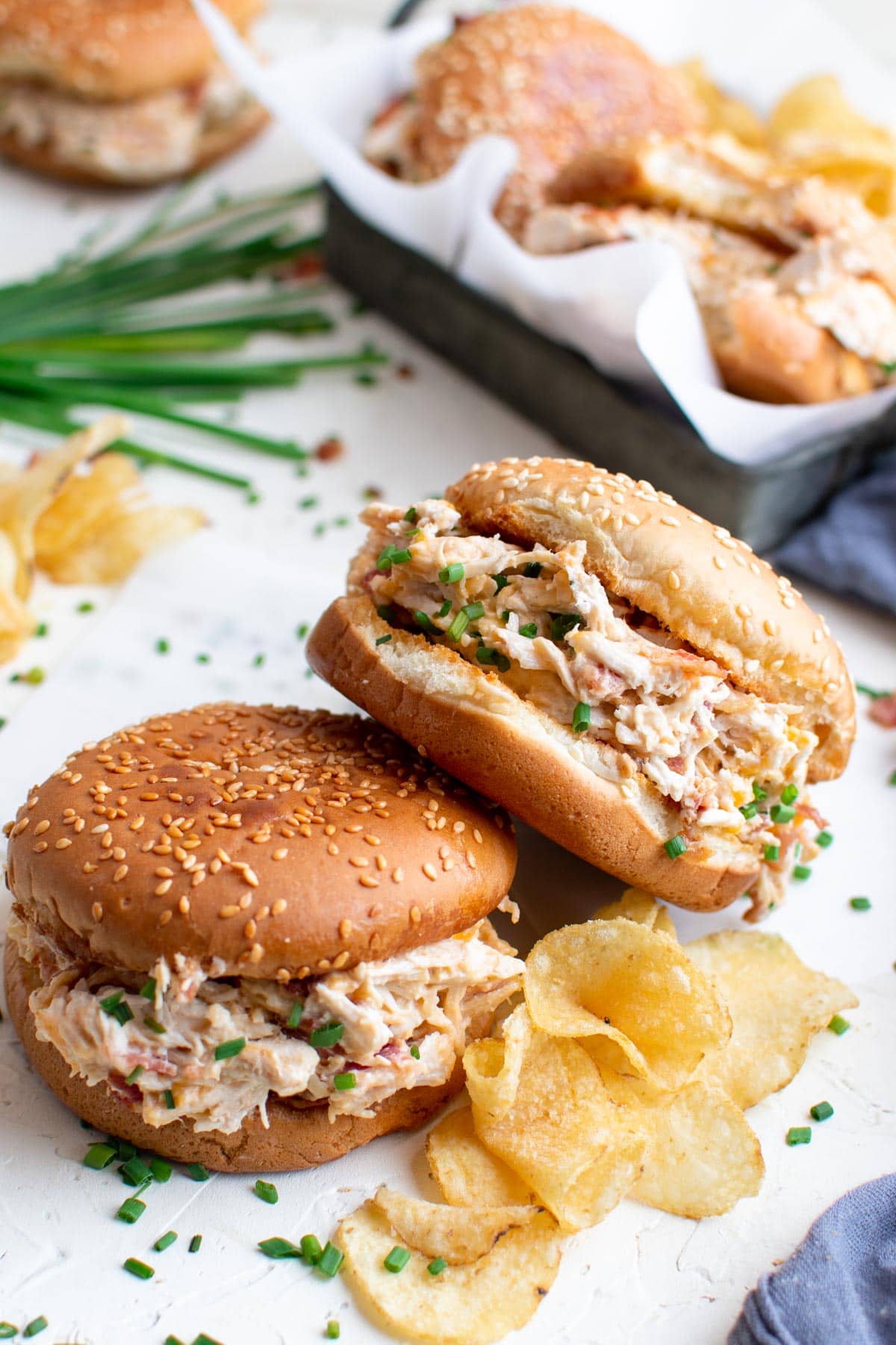 sesame seed buns, creamy bacon ranch chicken, potato chips, chives