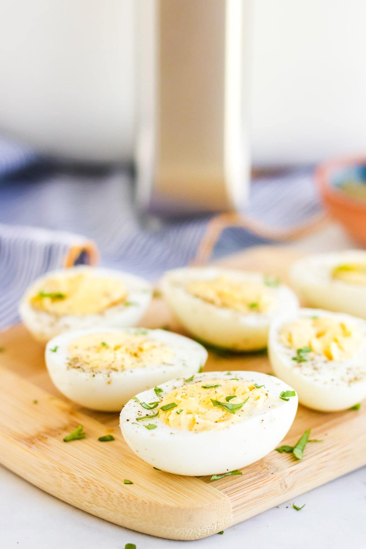 Hard boiled eggs, ut in half, with parsley and black pepper, air fryer