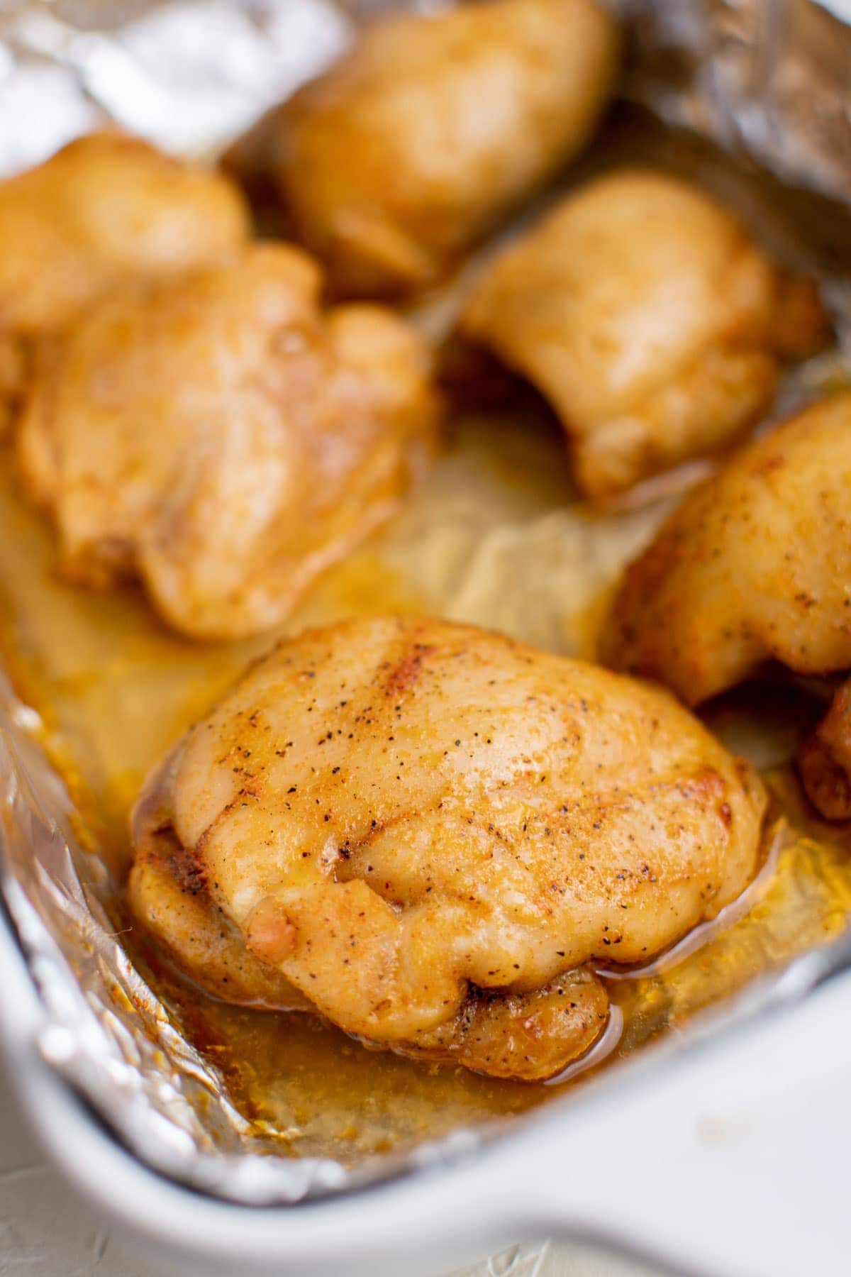 baked boneless chicken thighs, foil, baking dish