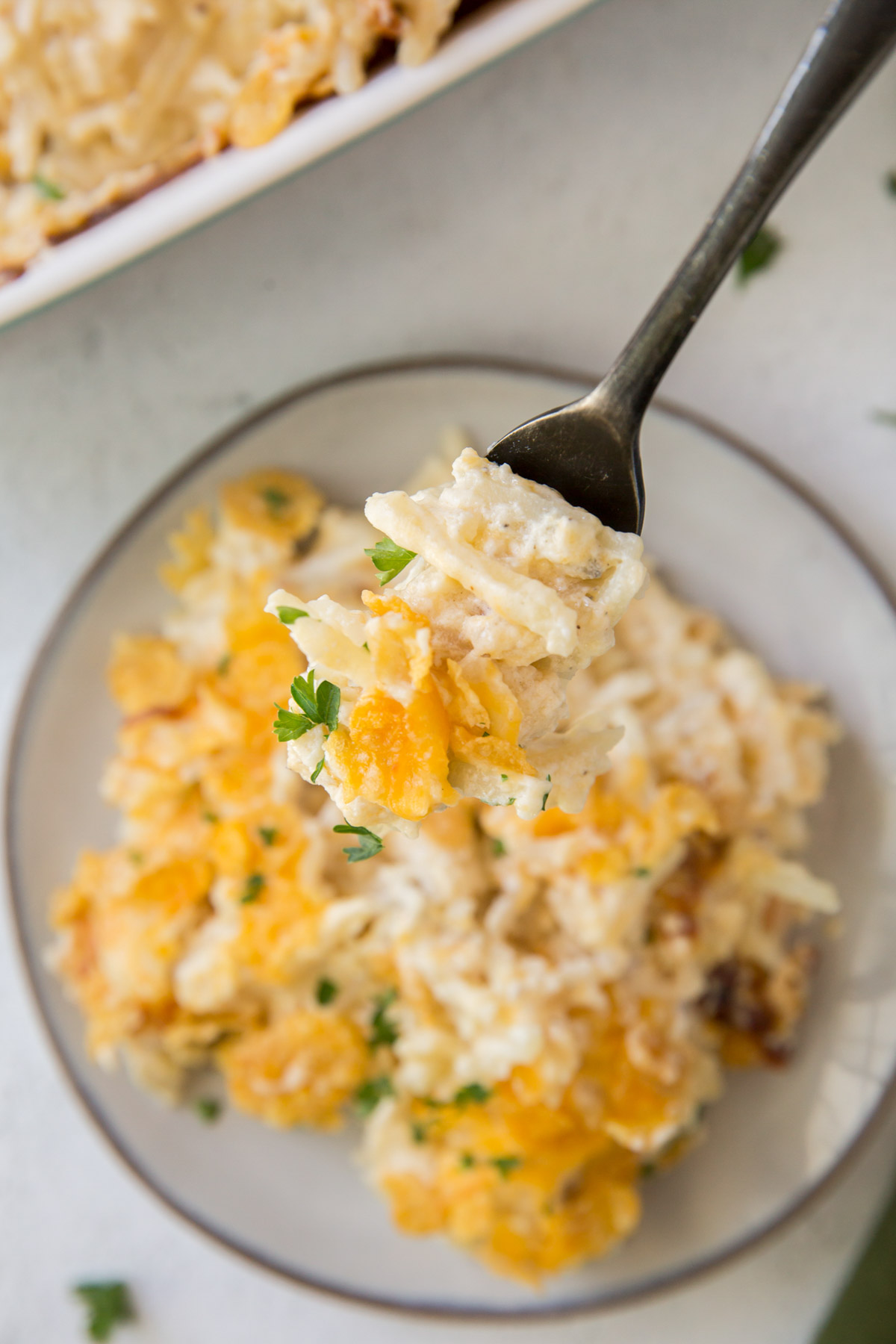 white plate with hashbrown casserole, forn