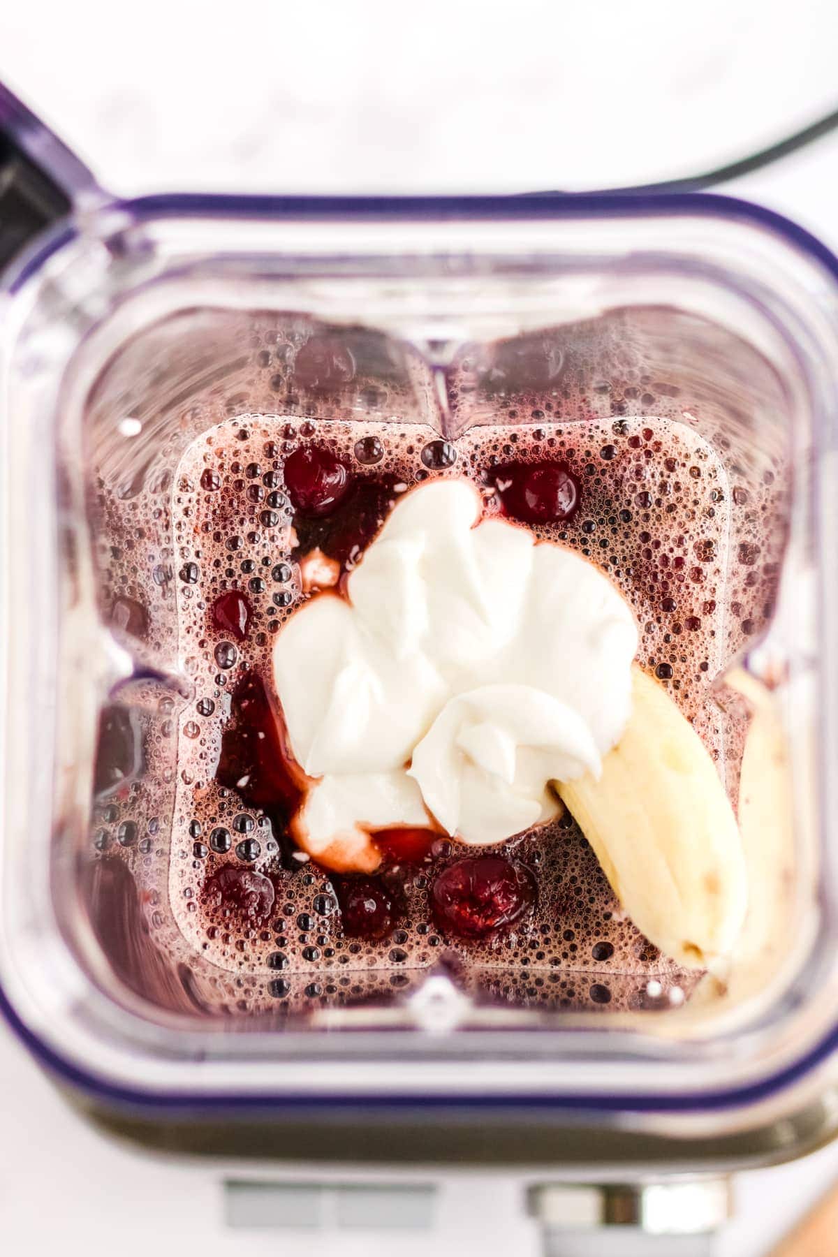 Ingredients for Cherry Smoothie in a blender, before it is mixed. 