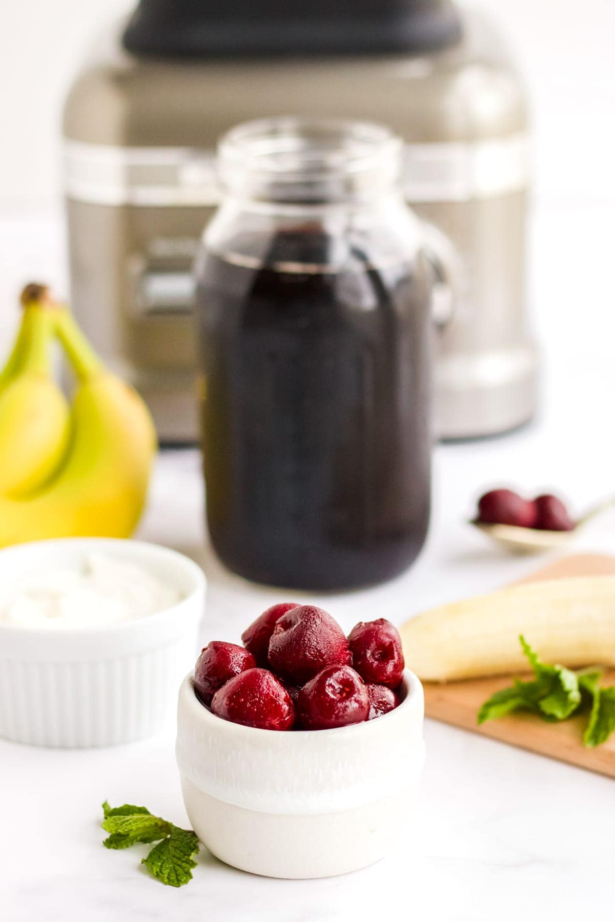 Ingredients to make a cherry smoothie.