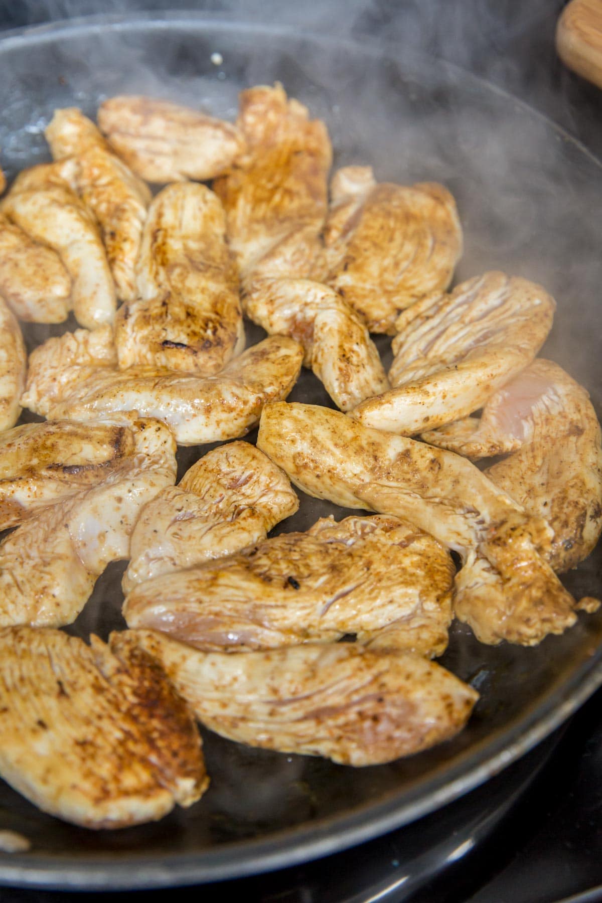 chicken tenders in a cast iron skillet