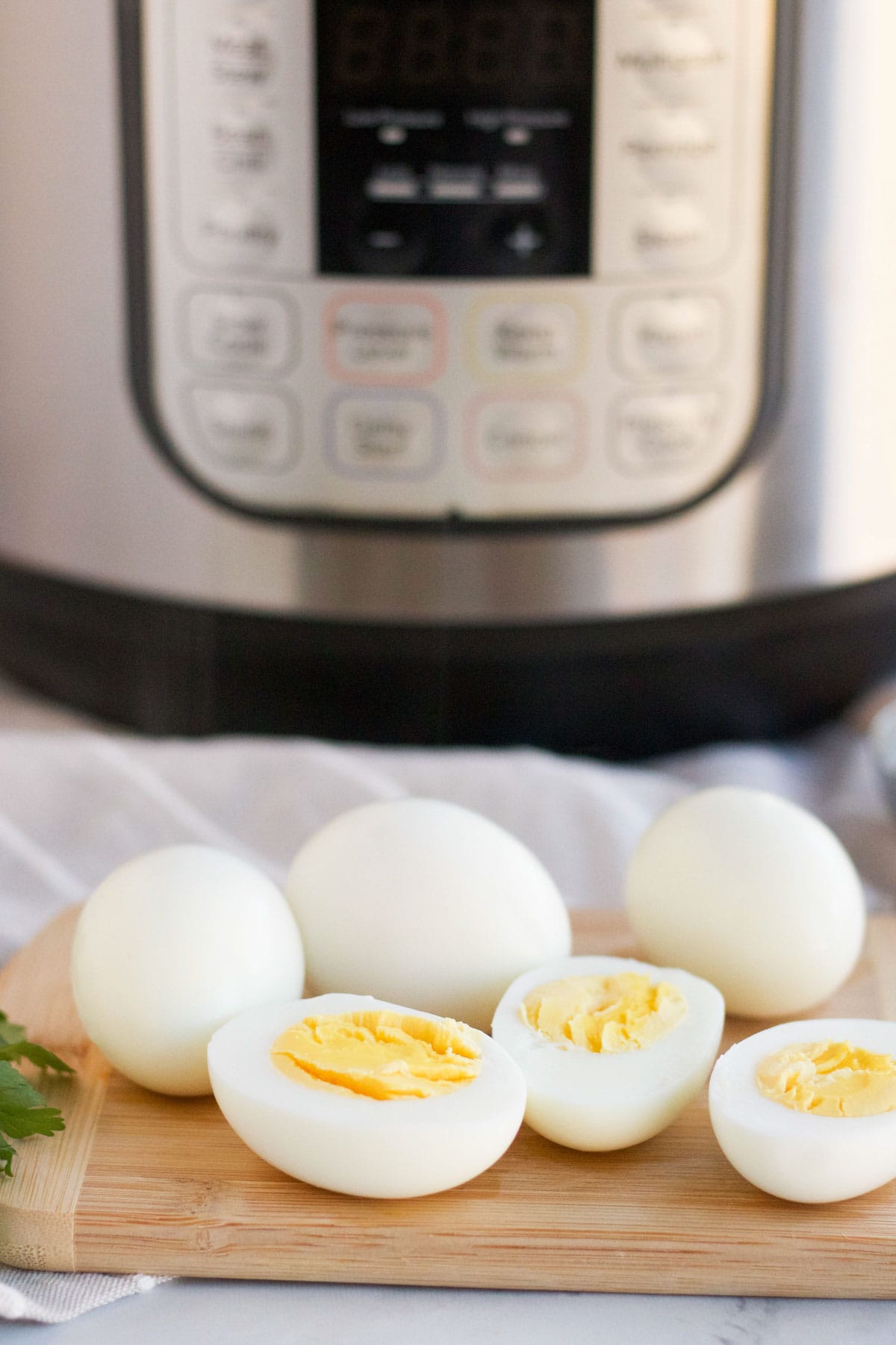 instant pot, eggs, cutting board, parsley