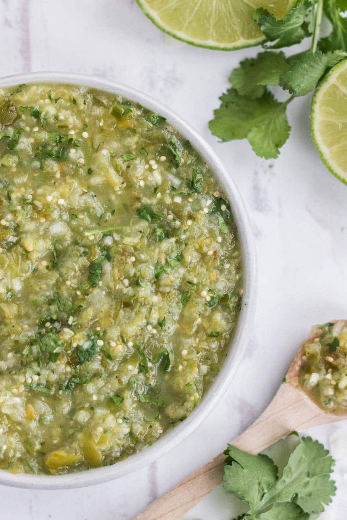 salsa verde, limes, white bowl, cilantro