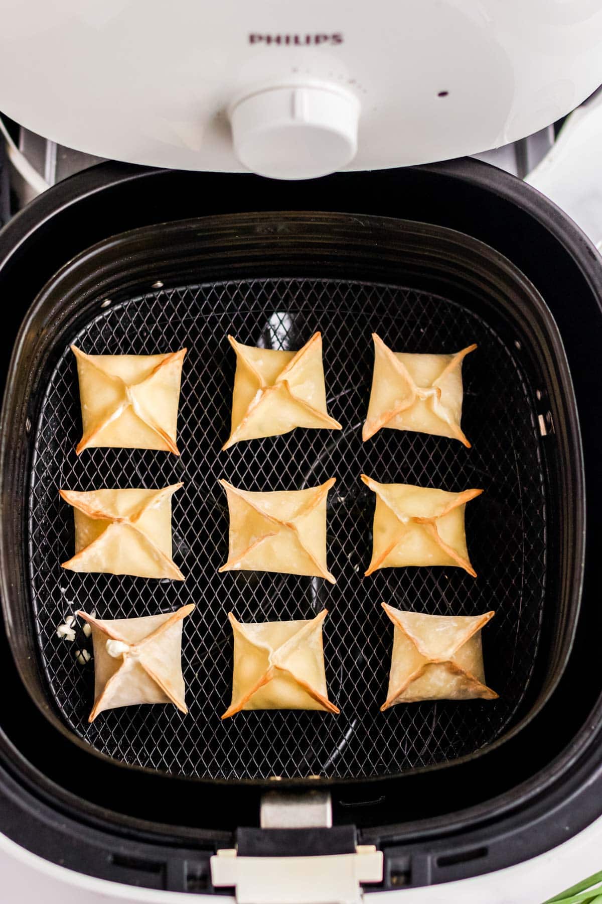 air fryer wontons in a basket